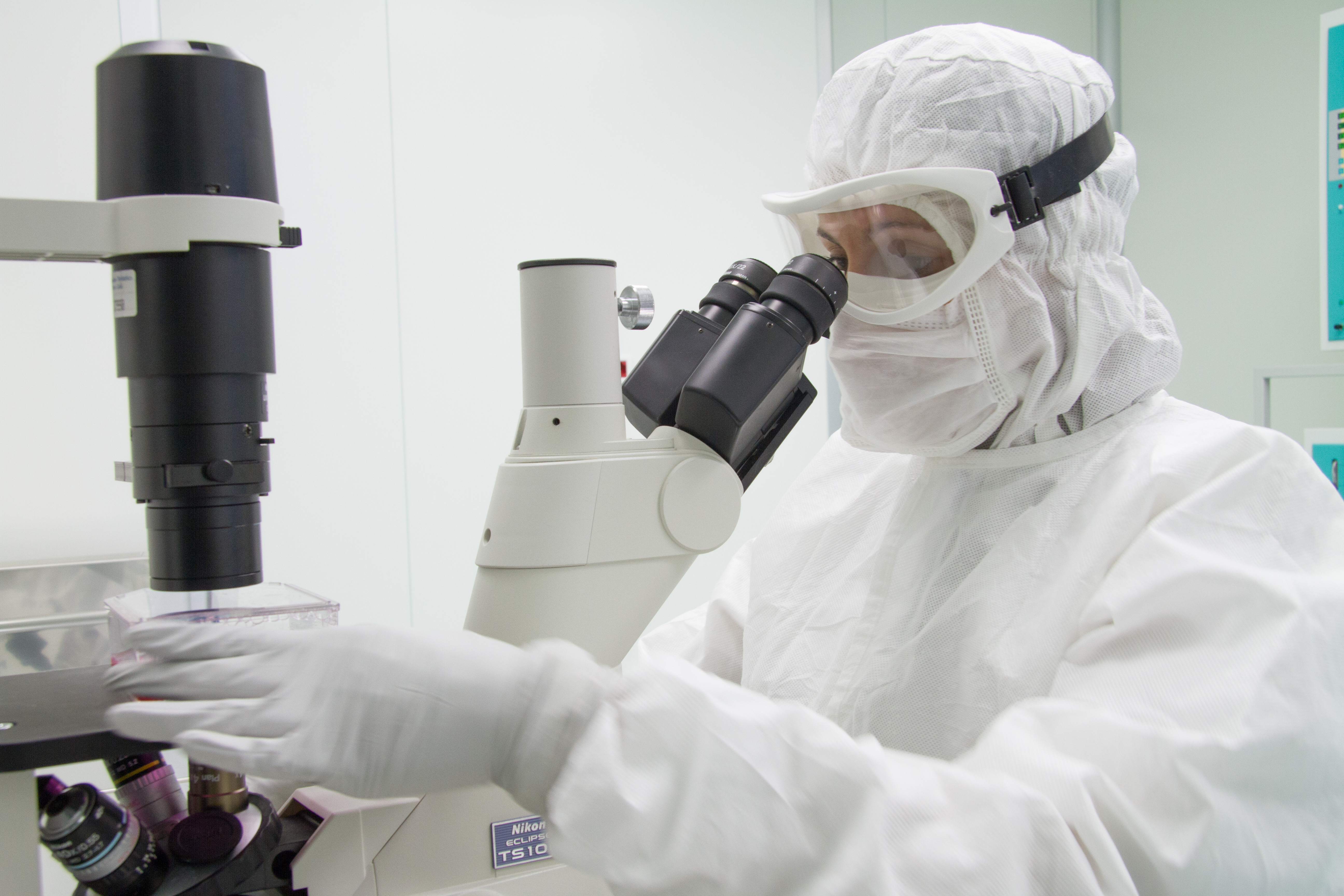 A researcher looks through a microscope in one of the research laboratories of the Bambino Gesù Pediatric Hospital. | Credit: Bambino Gesù Pediatric Hospital