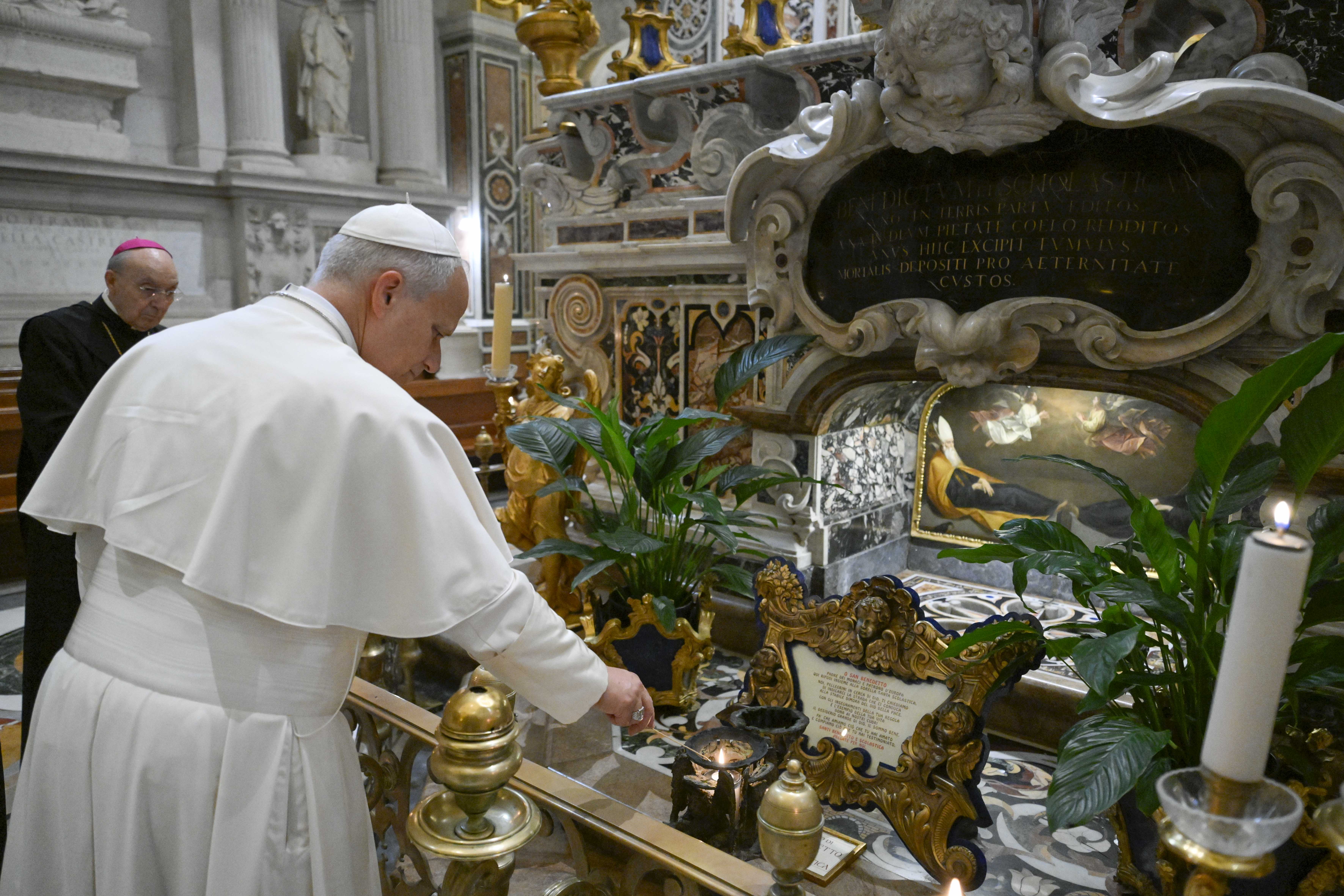 Pope Leo XIV lights a candle at the tomb of St. Benedict of Nursia at the Abbey of Montecassino on July 20, 2026. | Credit: Vatican Media