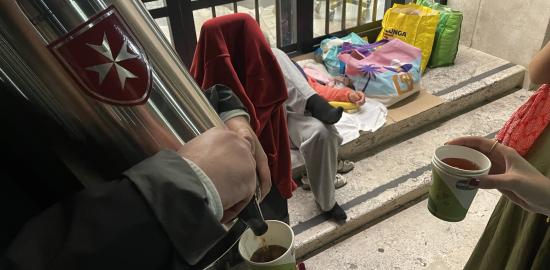 Young members of the Order of Malta help the homeless in St. Peter’s Square